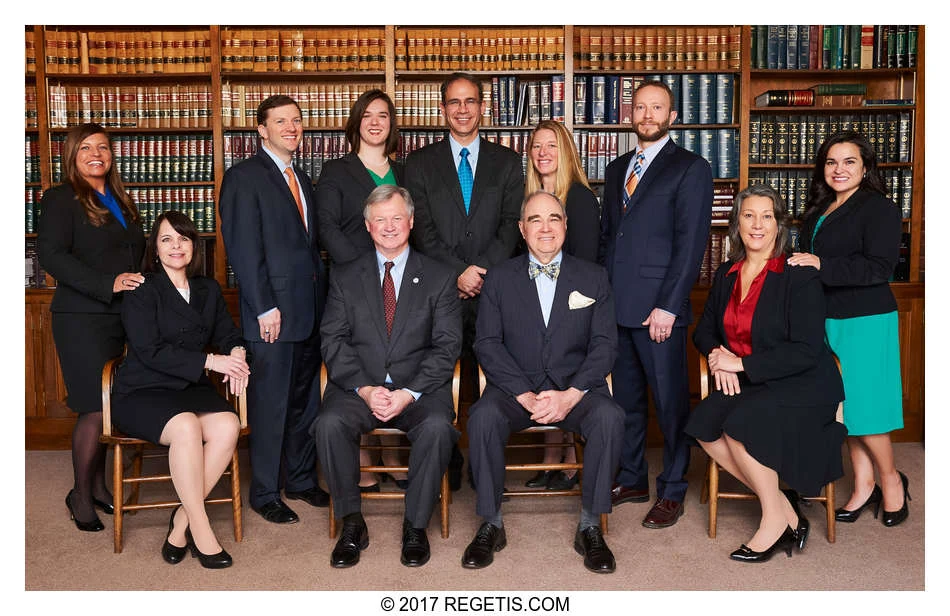 Walker Jones attorneys photographed together in front of law-library bookshelves by The Regeti’s