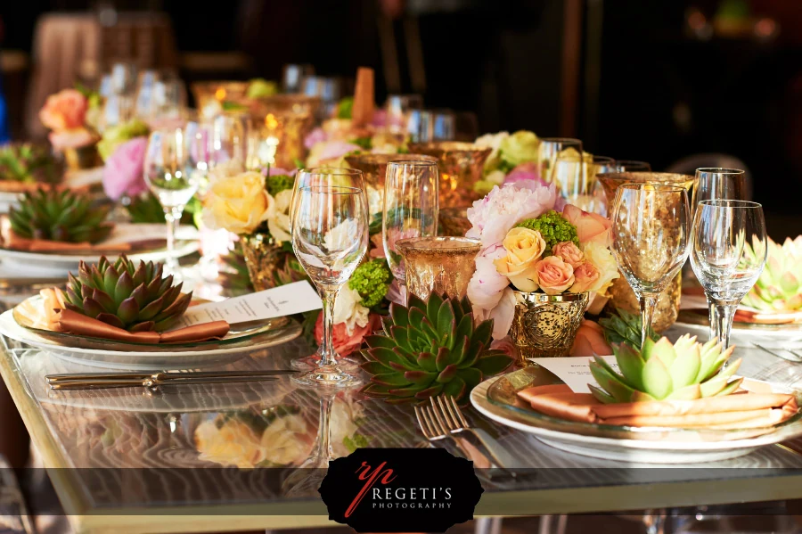 Pastel flowers, succulents, gold votives and place settings at the Engaged! show at Four Seasons Baltimore.