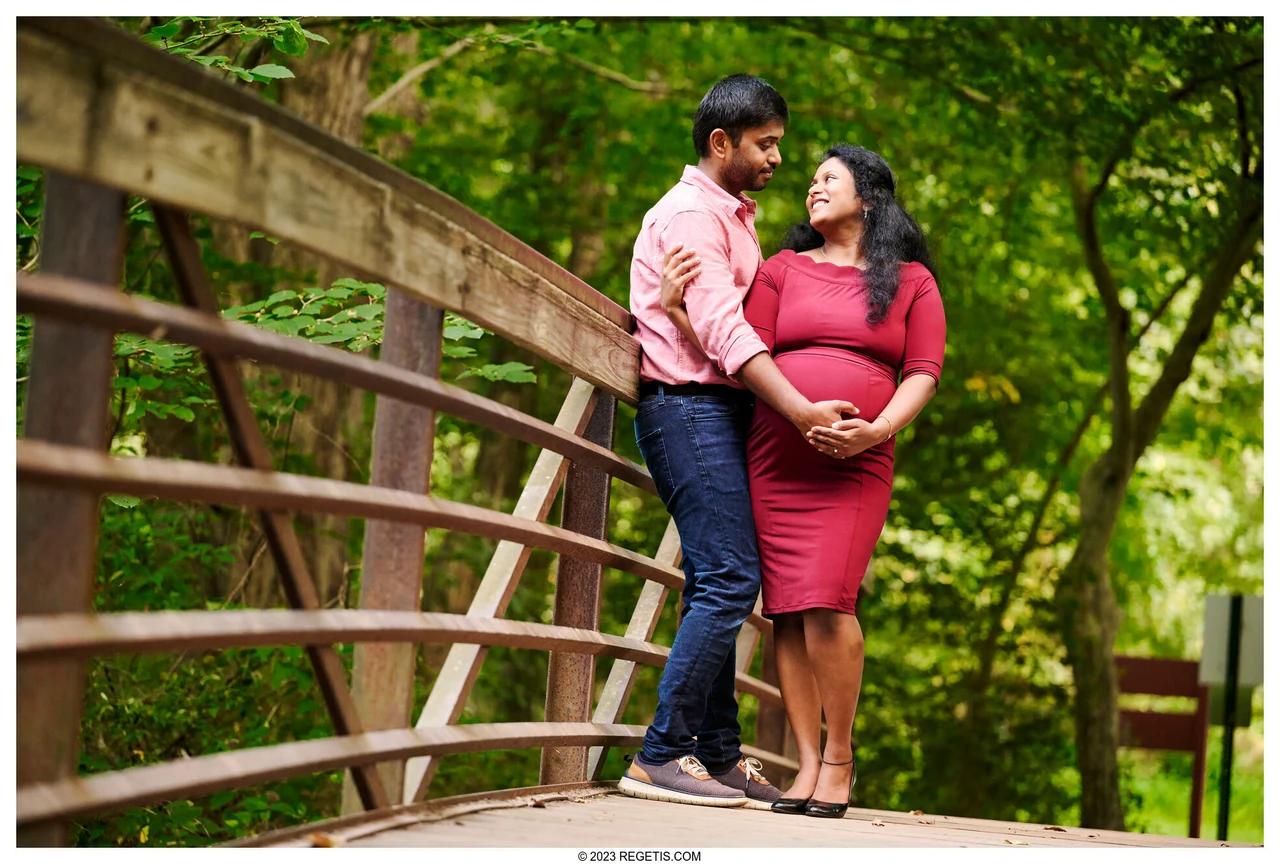 A couple standing together on a wooded footbridge at Ellanor C. Lawrence Park, photographed by The Regeti’s