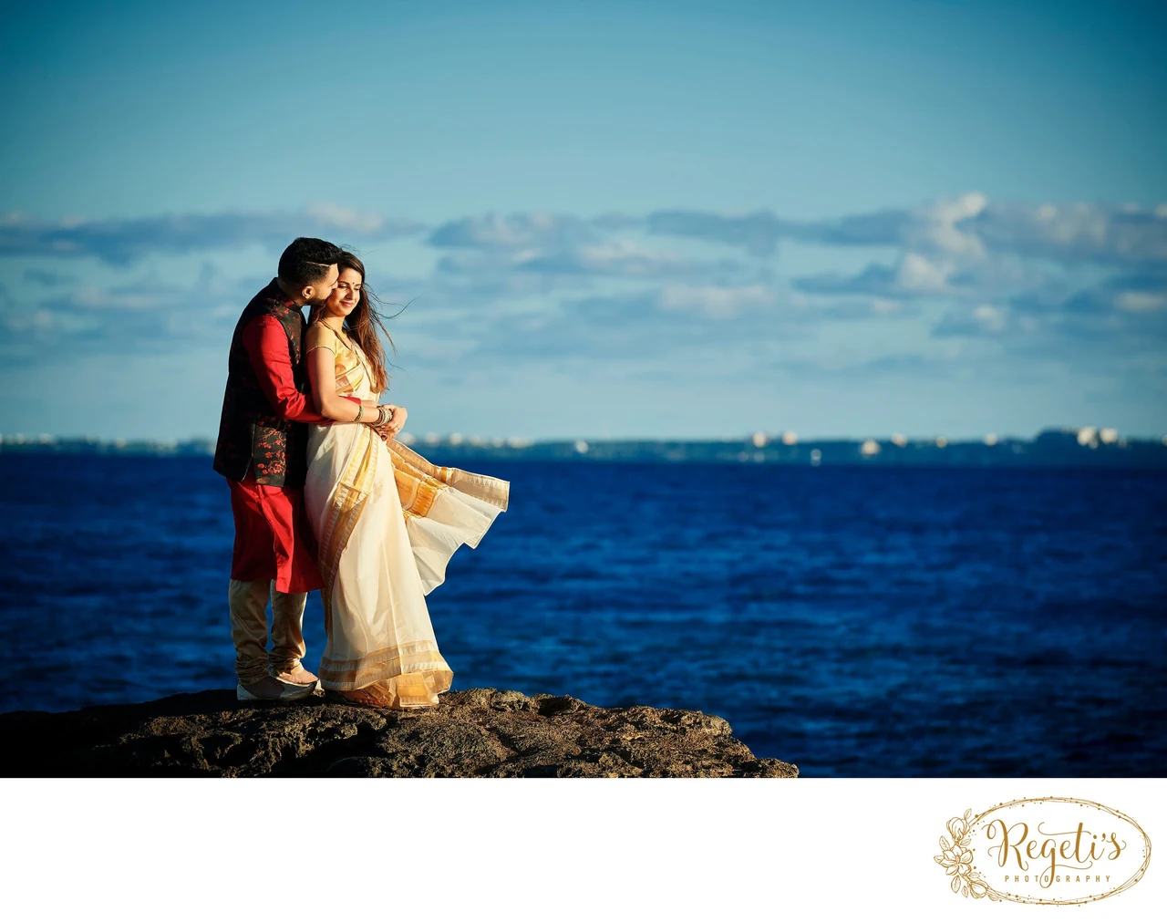 Shruthi and Anuj together beside the sea in Cancun before their wedding.