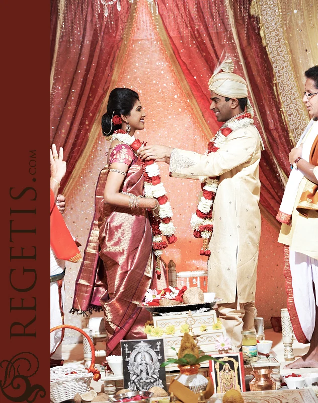 Vidya and Rakesh exchanging wedding garlands